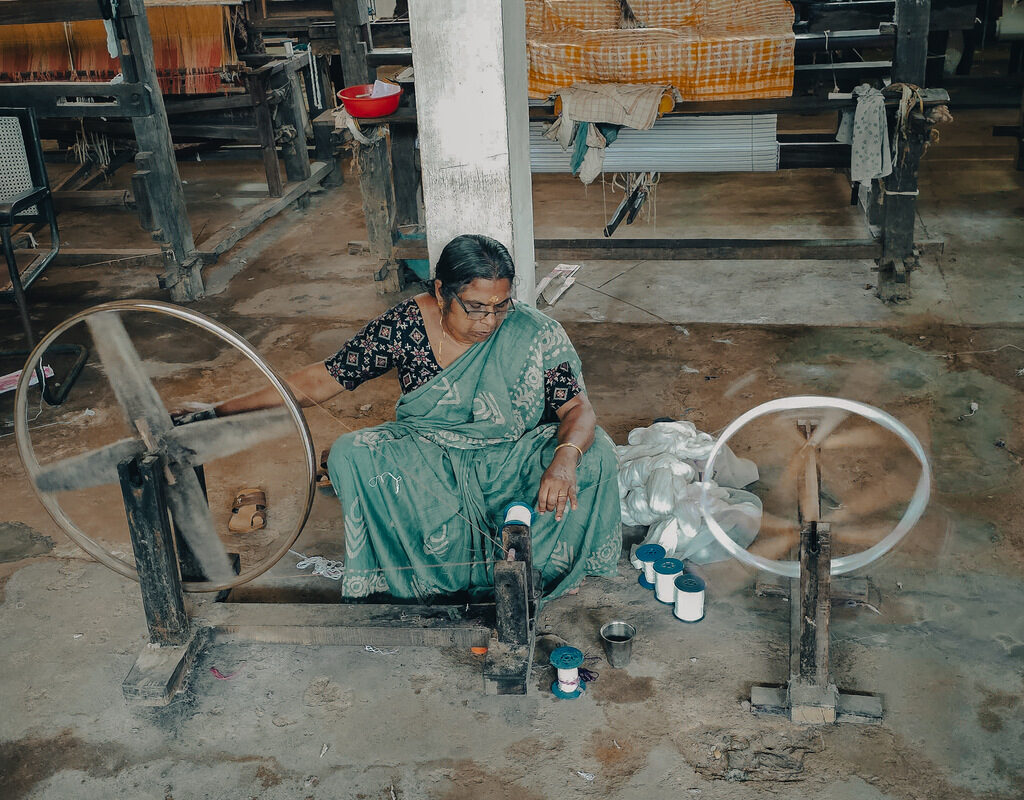 A lady preparing yarn